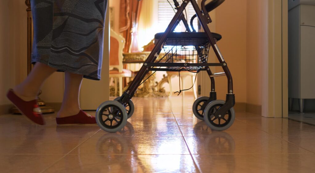 Physio For Your Family Member 3 elderly woman walks indoors with the walker detai 2025 03 23 21 26 16 utc converted